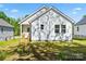Backyard with wooden stairs leading to a white home at 1105 Kenly St, Salisbury, NC 28144