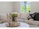 Bright living room featuring contemporary decor, plush seating, and a large window at 1105 Kenly St, Salisbury, NC 28144
