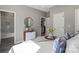 A peek into the main bedroom, which features an en-suite bathroom and an adjacent closet for storage at 1105 Kenly St, Salisbury, NC 28144