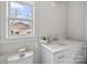 Small bathroom with white vanity and quartz countertop at 1320 Brook Rd, Charlotte, NC 28205