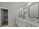 Elegant bathroom with double sinks, quartz countertops, and large mirrors at 1320 Brook Rd, Charlotte, NC 28205