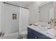 Bathroom with navy blue vanity and white subway tile at 1320 Brook Rd, Charlotte, NC 28205
