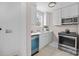 Modern galley kitchen, featuring stainless steel appliances and quartz countertops at 1320 Brook Rd, Charlotte, NC 28205