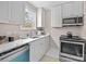 Modern kitchen with white cabinets and stainless steel appliances at 1320 Brook Rd, Charlotte, NC 28205