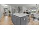 Spacious kitchen with gray island and white cabinetry, offering ample counter space at 1320 Brook Rd, Charlotte, NC 28205