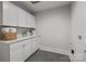 Convenient laundry room with white cabinets and quartz countertops at 1320 Brook Rd, Charlotte, NC 28205