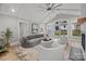 Cozy living room with vaulted ceiling, fireplace, and access to backyard at 1320 Brook Rd, Charlotte, NC 28205