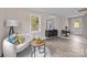 Comfortable living room with a cozy sofa and wood-look floors at 1320 Brook Rd, Charlotte, NC 28205