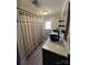 Stylish bathroom featuring a double vanity, modern fixtures, and a well-lit mirror, and wood style laminate flooring at 2100 Temple St, Kannapolis, NC 28081