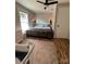 Comfortable bedroom with a queen bed, modern furniture, and a light fixture, creating a warm ambiance at 2100 Temple St, Kannapolis, NC 28081