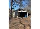 Detached garage with ample storage and parking space, located on a tree lined lot at 2100 Temple St, Kannapolis, NC 28081