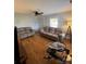 Spacious living room featuring hardwood floors, dual sofas, a ceiling fan, and modern lighting at 2100 Temple St, Kannapolis, NC 28081