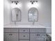 Modern bathroom featuring double vanity with modern light fixtures and hardware at 220 W Lawyers Rd, Monroe, NC 28110