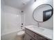 Bathroom featuring white vanity, modern fixtures, and a shower with dark hardware at 220 W Lawyers Rd, Monroe, NC 28110