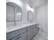 Bathroom with dual sinks, white countertops, gray cabinetry and modern mirrors at 220 W Lawyers Rd, Monroe, NC 28110