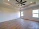 Bright bedroom features a ceiling fan, recessed lighting and wood-look flooring throughout the space at 220 W Lawyers Rd, Monroe, NC 28110