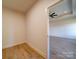 Bright bedroom showing doorframe to another room with wood-look flooring at 220 W Lawyers Rd, Monroe, NC 28110