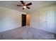 Bedroom featuring ceiling fan, carpet flooring, window and closet at 220 W Lawyers Rd, Monroe, NC 28110
