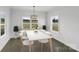 Bright dining room with hardwood floors and large windows at 220 W Lawyers Rd, Monroe, NC 28110