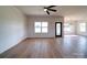 A wide view of an open-concept living space with light wood floors and natural light at 220 W Lawyers Rd, Monroe, NC 28110