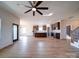 Spacious living room and kitchen offers an open floor plan with stainless appliances and wood floors at 220 W Lawyers Rd, Monroe, NC 28110