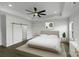 Bright and spacious main bedroom with tray ceiling, ceiling fan, and barn-style door at 220 W Lawyers Rd, Monroe, NC 28110