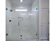 Tiled walk-in shower features glass enclosure, showerhead and tiled floor at 220 W Lawyers Rd, Monroe, NC 28110