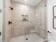 Large walk-in shower with neutral tile and glass enclosure at 312 Frazier Ave, Charlotte, NC 28216