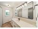 This is a bright bathroom featuring modern fixtures, ample counter space, and neutral decor at 2109 Rock Springs Cir, Denver, NC 28037