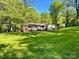 Charming single-story home with flowering shrubs and lush green lawn at 2109 Rock Springs Cir, Denver, NC 28037