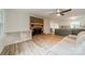 Inviting living room featuring a brick fireplace and seamlessly connected to the kitchen at 2109 Rock Springs Cir, Denver, NC 28037
