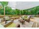 Inviting deck with seating area, perfect for outdoor relaxation and entertaining with beautiful wooded view at 2109 Rock Springs Cir, Denver, NC 28037
