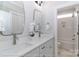 Bright bathroom featuring double vanity with white countertops, and shower with tiled walls at 4265 Candlewood Dr, Sherrills Ford, NC 28673