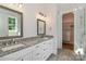 Bathroom featuring a dual sink vanity, granite countertop, and walk-in closet at 4265 Candlewood Dr, Sherrills Ford, NC 28673