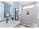 This bathroom includes white subway tile, a soaking tub and shower combination, and a vanity at 4265 Candlewood Dr, Sherrills Ford, NC 28673