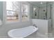 This bathroom has a soaking tub and large windows at 4265 Candlewood Dr, Sherrills Ford, NC 28673