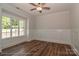Bright bedroom featuring beautiful hardwood floors, trim, and large window views at 4265 Candlewood Dr, Sherrills Ford, NC 28673