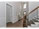 Elegant entryway with hardwood floors, staircase, and a view of the front door at 4265 Candlewood Dr, Sherrills Ford, NC 28673