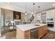 Open-concept kitchen featuring a large island with a sink and stainless steel appliances at 4265 Candlewood Dr, Sherrills Ford, NC 28673