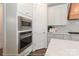 Modern kitchen with stainless steel appliances, white cabinets, and marble countertops at 4265 Candlewood Dr, Sherrills Ford, NC 28673