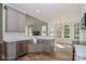 Open kitchen with stainless steel appliances and hardwood floors, overlooking the living space at 4265 Candlewood Dr, Sherrills Ford, NC 28673