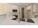 Bright kitchen featuring a stainless steel sink, white cabinets, and subway tile backsplash at 4265 Candlewood Dr, Sherrills Ford, NC 28673