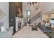Open-concept living room with cozy fireplace and adjacent to stairs to 2nd floor at 4265 Candlewood Dr, Sherrills Ford, NC 28673