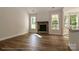 Cozy living room with stone fireplace and plenty of natural light from large windows at 4265 Candlewood Dr, Sherrills Ford, NC 28673