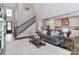 Bright living room with stairs to 2nd floor and view into modern kitchen at 4265 Candlewood Dr, Sherrills Ford, NC 28673