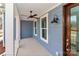 Inviting covered porch with ceiling fan, stylish light fixture, and a glimpse of the outdoor view at 4265 Candlewood Dr, Sherrills Ford, NC 28673