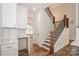 Beautiful staircase with wood banister, offers a view from the kitchen at 4265 Candlewood Dr, Sherrills Ford, NC 28673