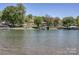 Wide water view featuring boat docks, lush trees, and serene scenery at 4265 Candlewood Dr, Sherrills Ford, NC 28673
