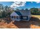Aerial view of a new construction home, showcasing its side and backyard at 636 Edwards Rd, Fort Lawn, SC 29714
