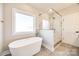 Bathroom with soaking tub, walk-in shower, and window at 636 Edwards Rd, Fort Lawn, SC 29714
